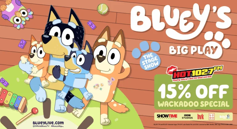 Four cartoon dogs from Bluey sit together on a playroom floor, surrounded by toys. Text promotes Blueys Big Play stage show and a 15% off Wackadoo Special offer with HOT102.7 FM. Dont miss the excitement of Big Play fun!.